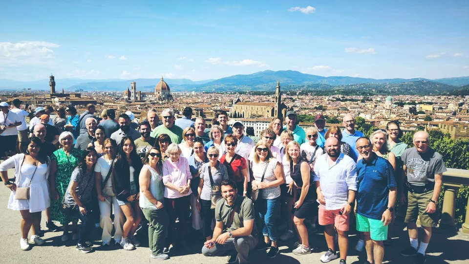 Sasha Rojnik and his tour group overlooking the city skyline